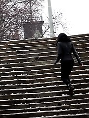 15 pictures - Pretty dark haired girl melts snow as she pees