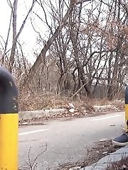 15 pictures - Brunette girl squats near a car to piss outside