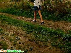 16 pictures - Babe tinkles on a road in the middle of a field