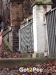 15 pictures - Dark haired babe pulls her panties while pissing