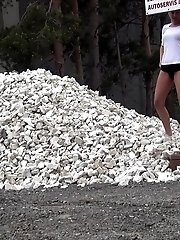 15 pictures - Cute girl pisses onto a pile of rubble