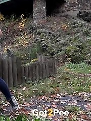 15 pictures - European girl in red tee pisses on fallen leaves
