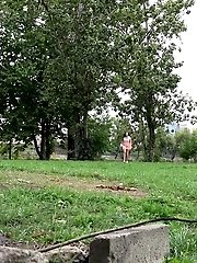 15 pictures - Sitting on a concrete block this brunette pees