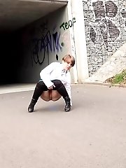 15 pictures - Short haired babe sprays her piss over the ground
