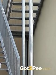 15 pictures - Sexy brunette pees on the aluminium steps