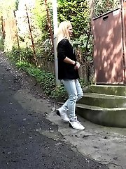 15 pictures - Stunning blonde pisses her denims outside