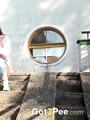 15 pictures - Redhead is desperate to pee while outside