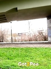 15 pictures - Brunette amateur pisses in public for Got2Pee