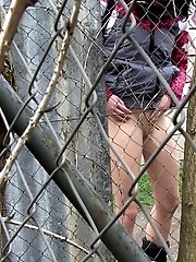 15 pictures - Dark haired girl pisses on a public path