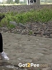 15 pictures - Exotic babe squats to piss near main road