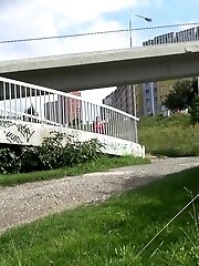 15 pictures - Brunette pulls down trousers to pee in public