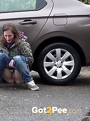 15 pictures - Two friends piss behind a parked car