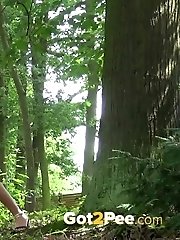 15 pictures - Sexy blonde pees in the forest