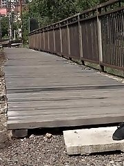 15 pictures - Dark haired European pissing outside in public