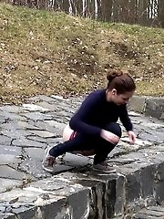 15 pictures - Antonia pees outside next to drainage pipe