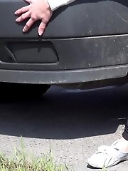 15 pictures - Pretty brunette pisses next to a parked van