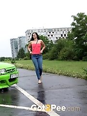 15 pictures - Public pissing for dark haired babe in denims