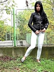 15 pictures - Exotic looking babe is desperate to piss outside