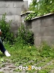 15 pictures - Blonde girl has a powerful piss outside