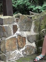 15 pictures - Blonde babe in blue pisses on the ground outside