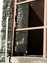15 pictures - Brunette pissing outside over the edge of steps