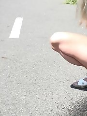 15 pictures - Pretty blonde squats in a cycle track to piss