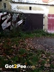 15 pictures - Blonde babe pees next to some garages