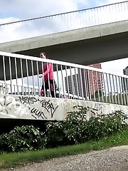 15 pictures - Brunette pulls down trousers to pee in public