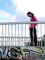 15 pictures - Brunette pulls down trousers to pee in public