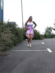 15 pictures - Tattooed blonde empties her bladder outside