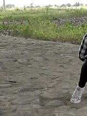 15 pictures - Exotic babe squats to piss near main road