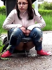 15 pictures - Brunette in glasses pees onto her trainers