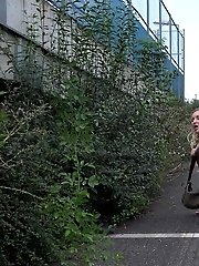 15 pictures - Tattooed blonde empties her bladder outside