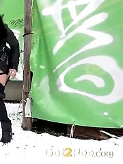15 pictures - Pretty dark haired girl melts snow as she pees