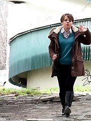 15 pictures - Cute girl in boots pisses outside in the city