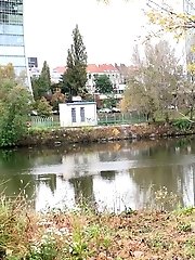 15 pictures - Dark haired European pisses outside by river