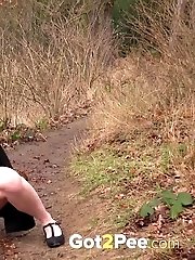 15 pictures - Sexy secretary squats and pisses on a path