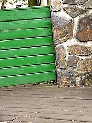 15 pictures - Pretty babe pisses onto a wooden terrace