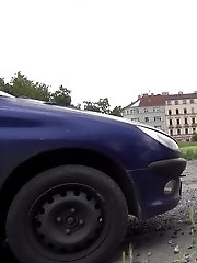 15 pictures - Dark haired babe pisses behind a parked car