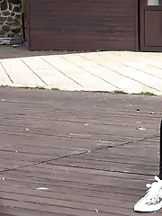 15 pictures - Brunette in glasses pisses on wooden decking