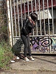 15 pictures - City pissing for stunning black haired babe